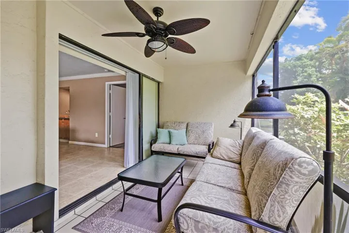 Lanai with ceiling fan door to backyard