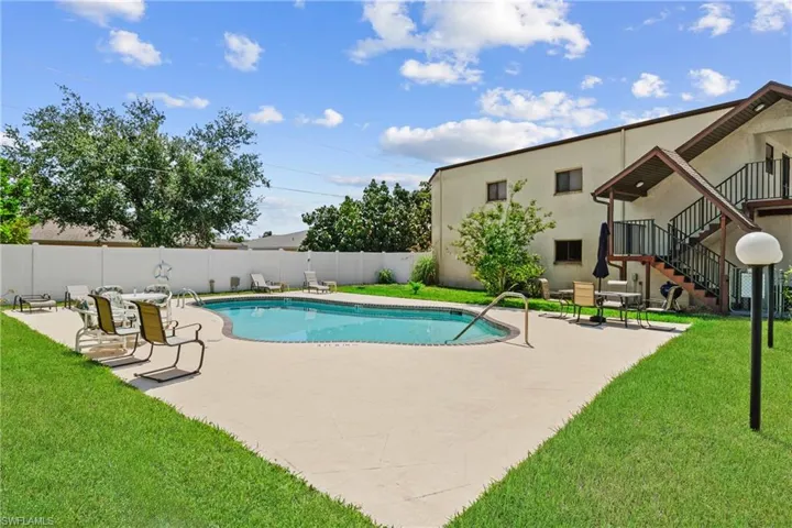 View of pool with a yard and a patio area