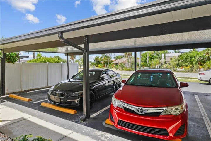View of vehicle parking with a carport