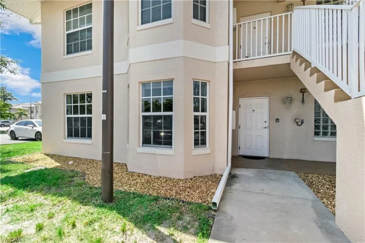 View of exterior entry featuring a balcony