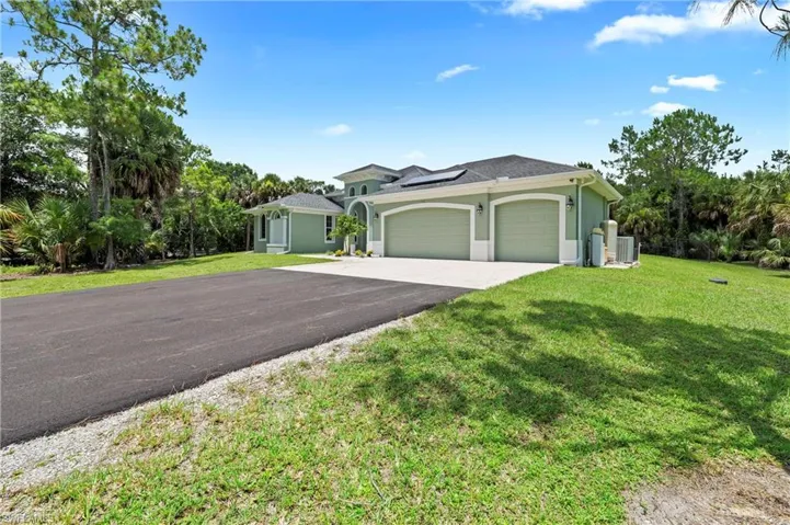 Contemporary exterior with a double garage and a paved driveway