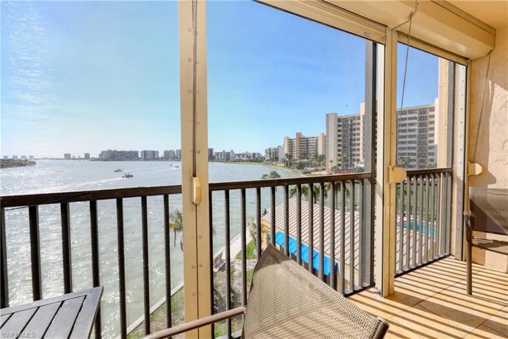 Sunroom with a water view