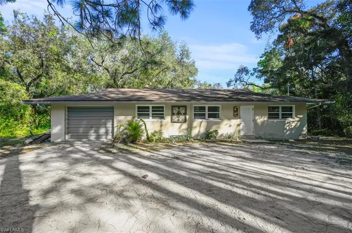 Single story home featuring a garage