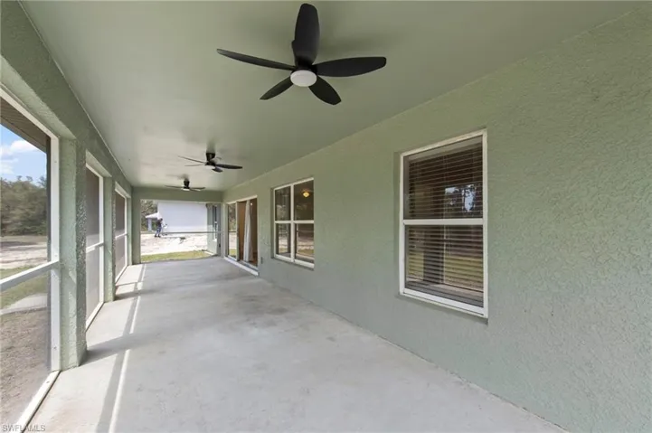 Oversized screened lanai with 3 ceiling fans
