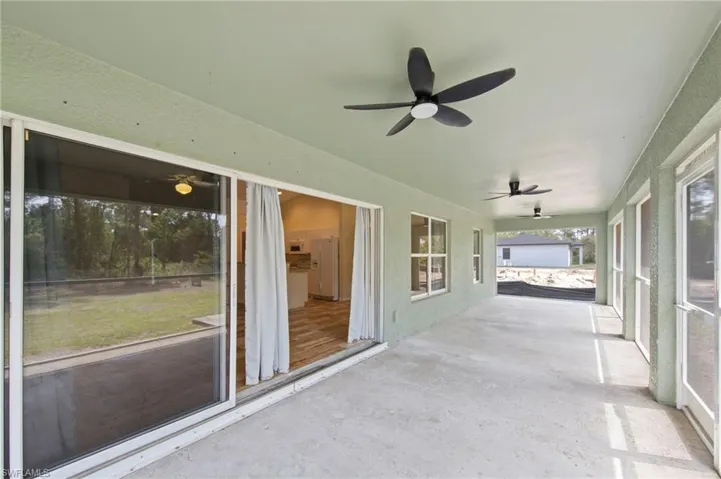 Oversized screened lanai with 3 ceiling fans