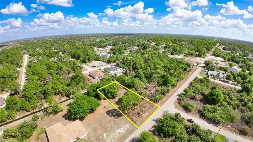 Aerial perspective of suburban area with property parcel outlined