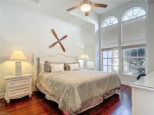 Bedroom featuring dark wood-type flooring and a ceiling fan