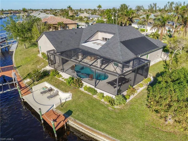 Aerial view of a nearby body of water and a pool area