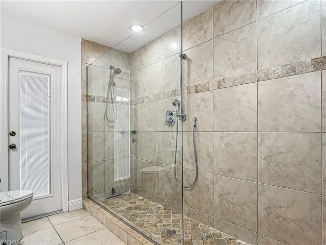 Bathroom featuring a stall shower and tile patterned floors