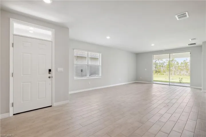 Foyer entrance with light hardwood / wood-style floors
