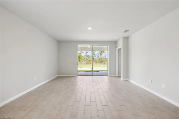 Spare room with light wood-type flooring