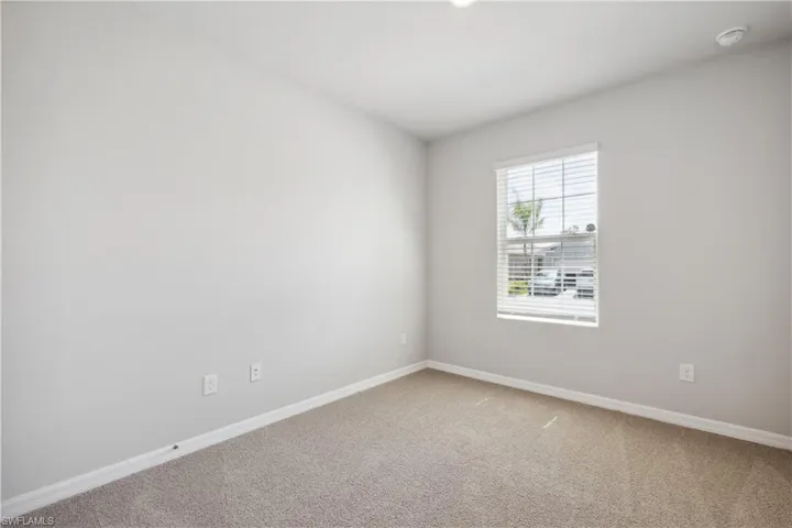 Unfurnished room with carpet flooring