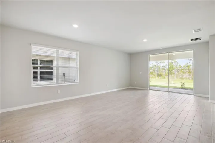 Unfurnished room with light hardwood / wood-style flooring