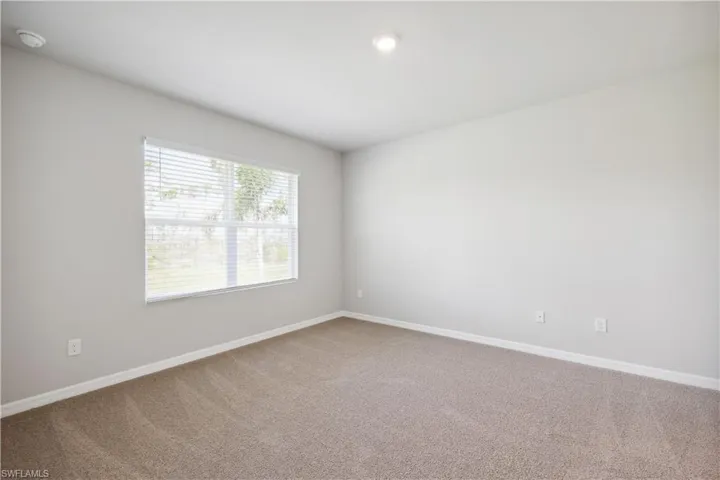 Spare room with carpet flooring