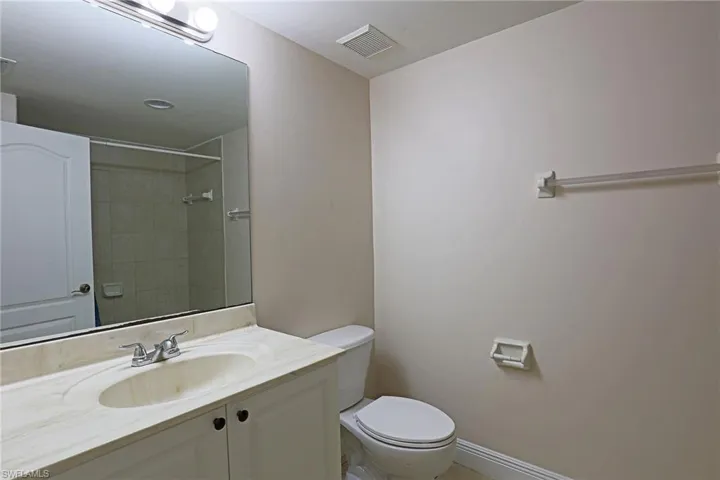 Full bath featuring vanity and a shower