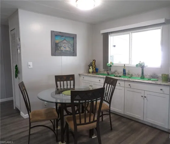 Dining room with Laminated finished floors and baseboards