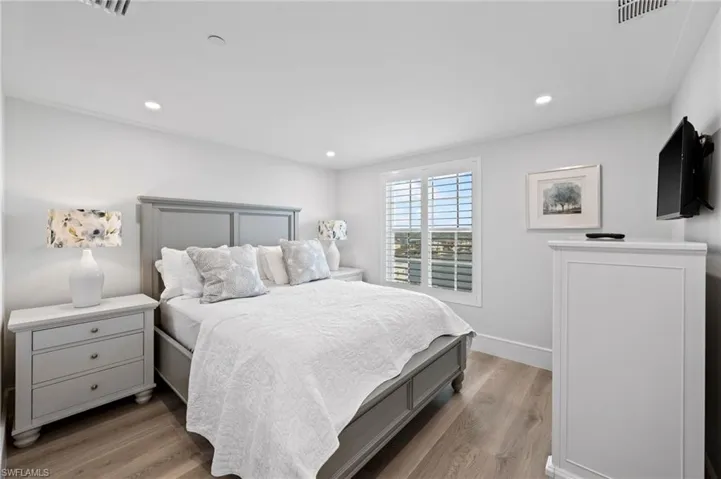 Bedroom with light hardwood / wood-style floors