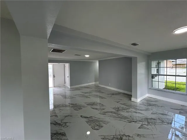 Empty room with tile patterned flooring