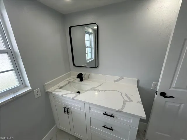 Bathroom with plenty of natural light and vanity