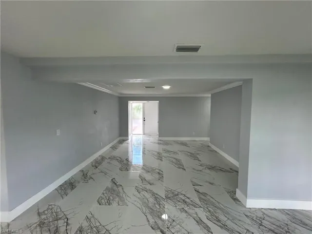 Empty room with tile patterned floors