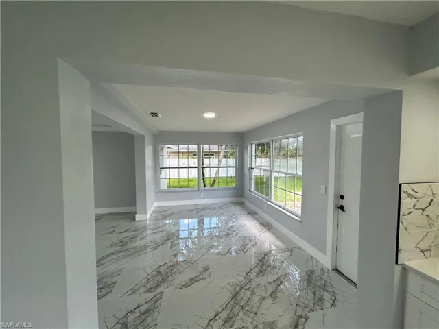 Spare room featuring light tile patterned floors