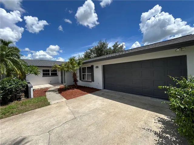 Single story home featuring a garage