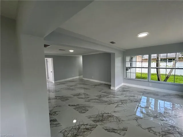 Spare room featuring tile patterned flooring