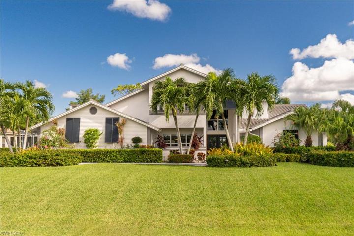 Front of home showing Bahama Shutters