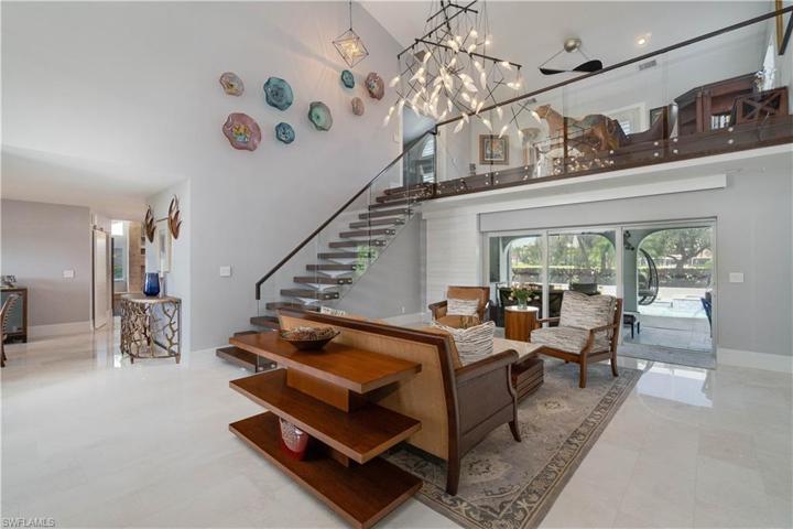 Sliding doors open to lanai and pool.