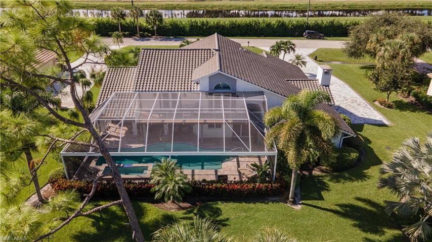Aerial view showing back of home and Pool cage.