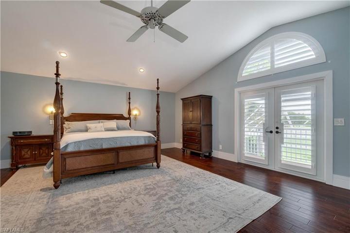 Large Master with doors leading to outside balcony.