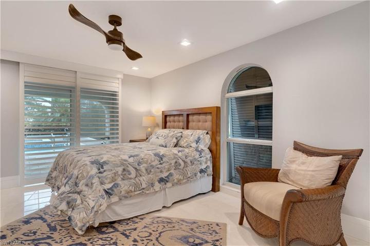 Sliding doors open to pool with ensuite Jack and Jill bathroom.
