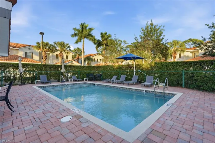 Community pool with a patio area
