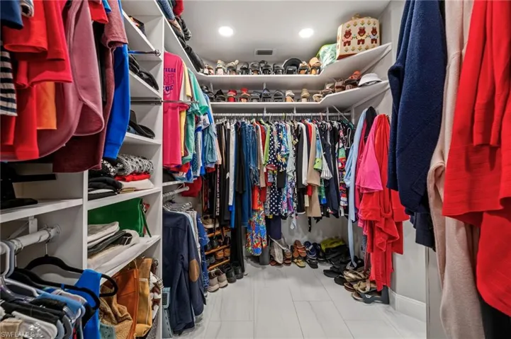 Custom built shelving in large walk-in closet