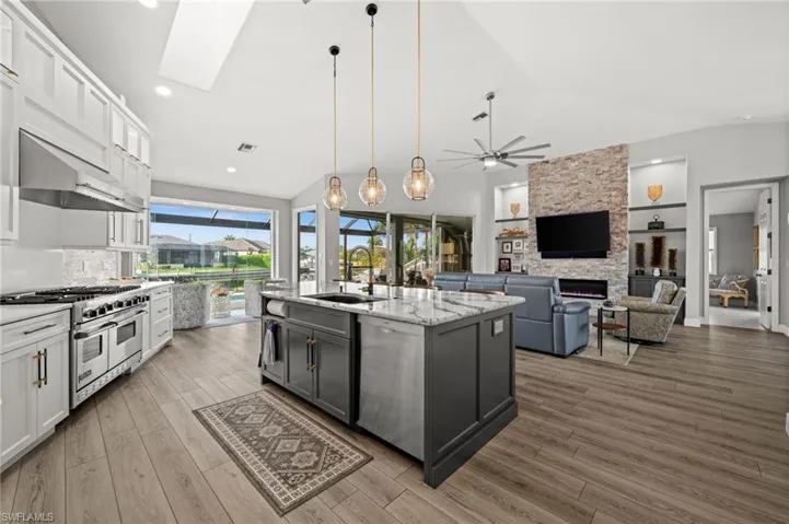 The open-concept kitchen flows seamlessly into the living area, creating a perfect space for entertaining