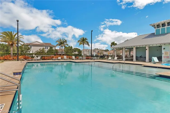 Community pool with a patio