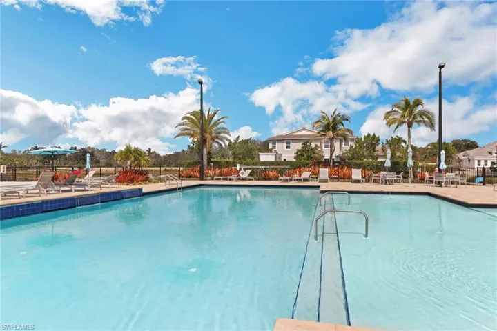 Community pool with a patio