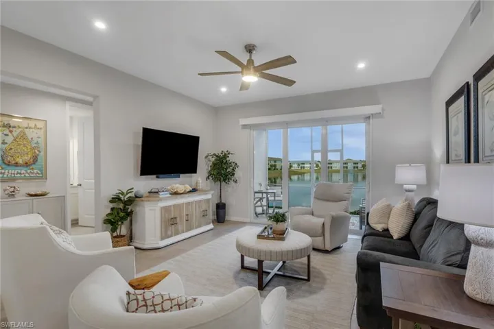 Living area featuring ceiling fan and recessed lighting