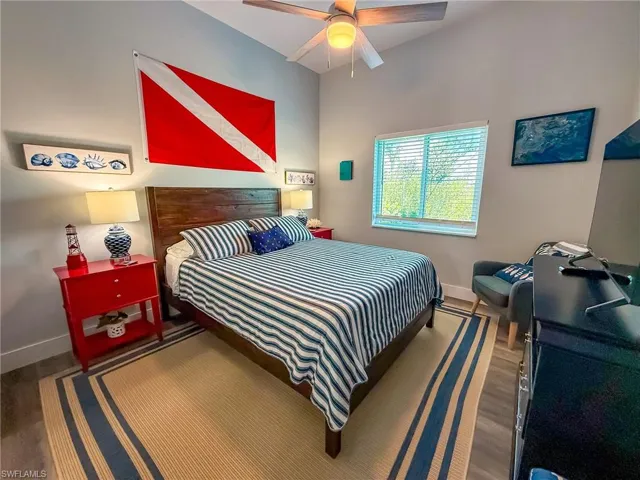 Recreation room with wood walls and a ceiling fan