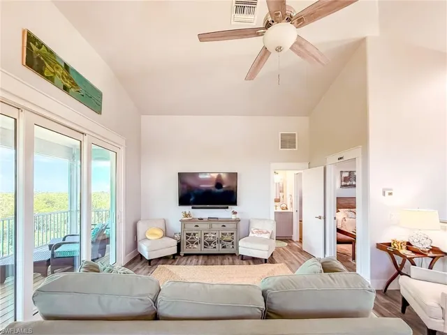 Bedroom featuring dark wood-style flooring and ceiling fan