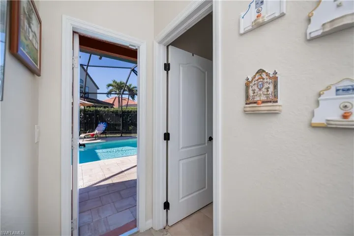 door to lanai from pool bath