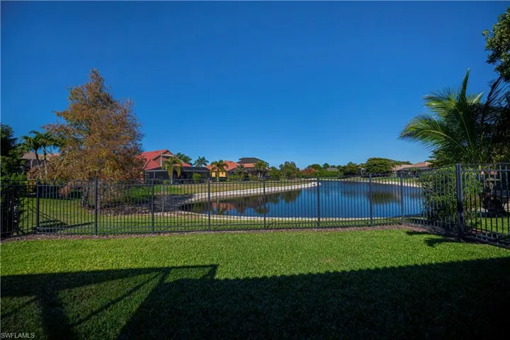 back yard with 6 foot fence and water view