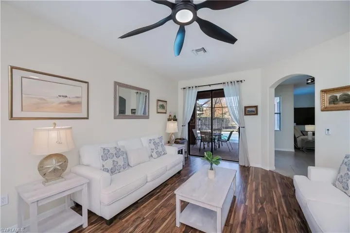 living room  looking out to lanai and entry to family room and kitchen