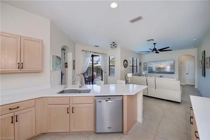 kitchen looking into family room and slider to the lanai