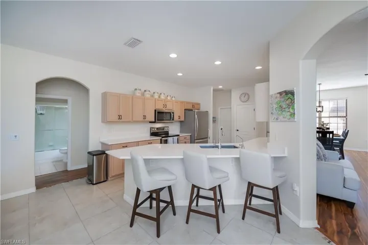 family room looking into kitchen and living room