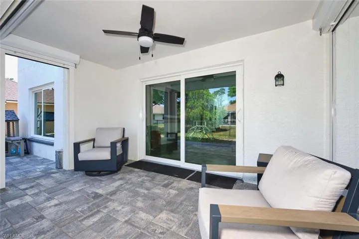 View of patio featuring ceiling fan