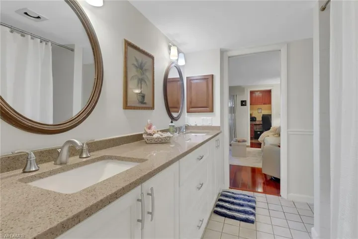 Bathroom with vanity and tile patterned flooring