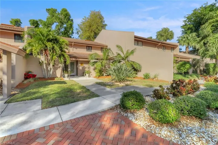 Mediterranean / spanish home featuring a front lawn