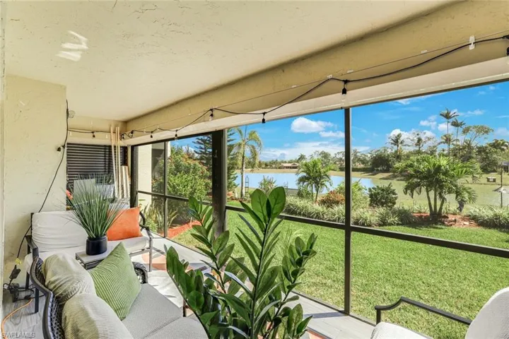Sunroom / solarium with a water view
