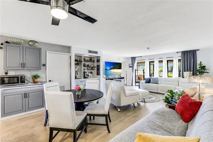 Dining area featuring a ceiling fan and light wood-style floors